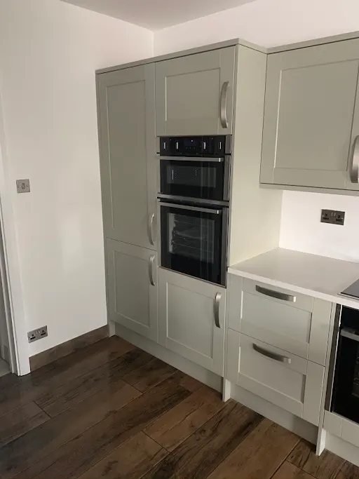 Sage green kitchen with double oven, Bexley